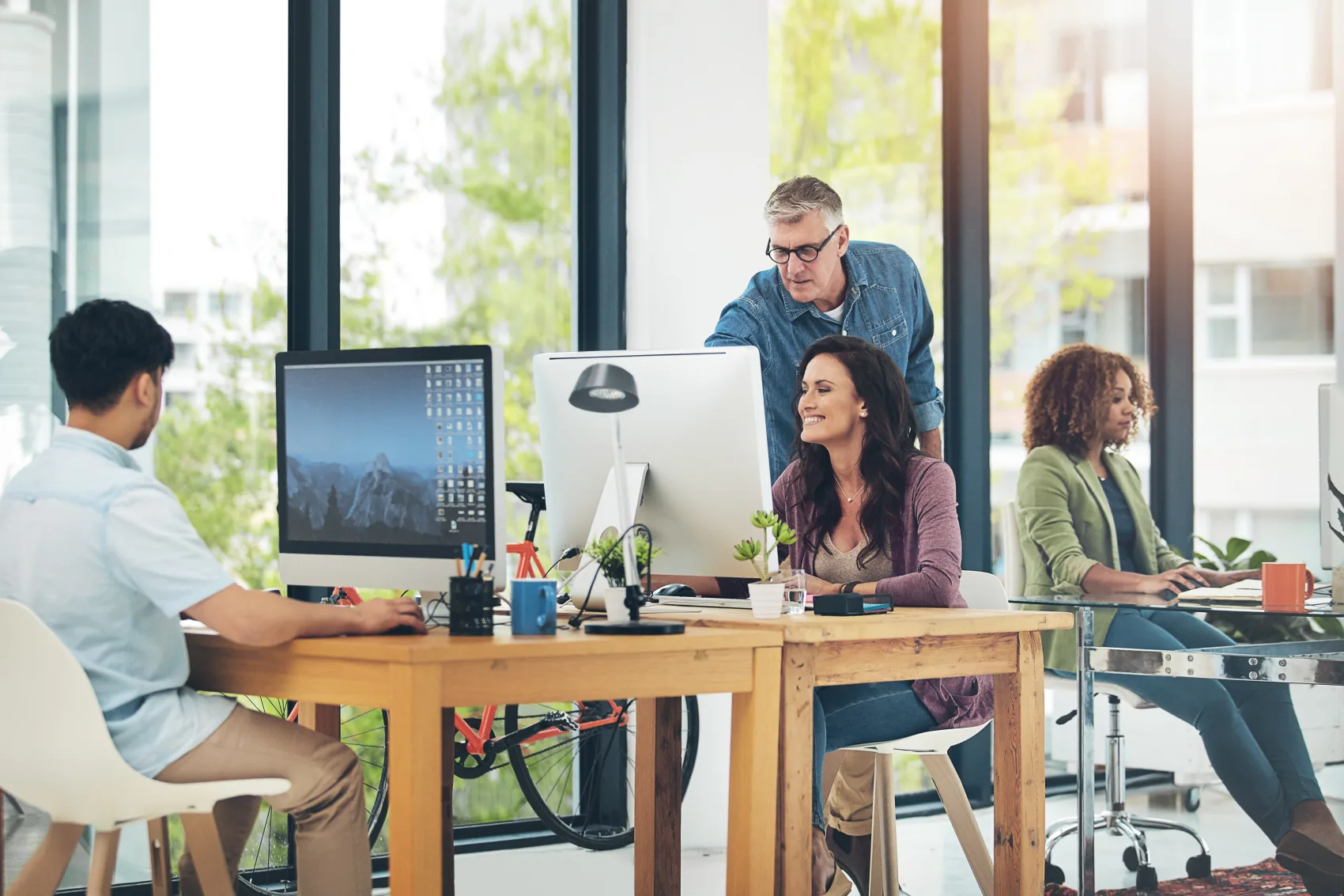 Colleagues working together in an open-plan office