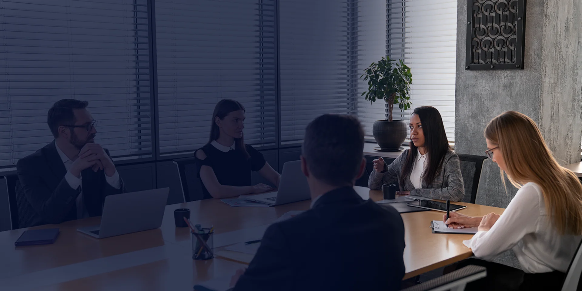 Ferfier leaders in discussion around a meeting-room table